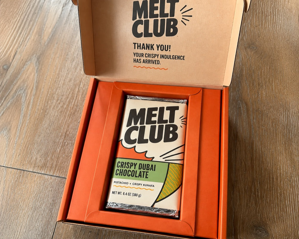 Melt Club box opened, bar nestled in cold-pack carton